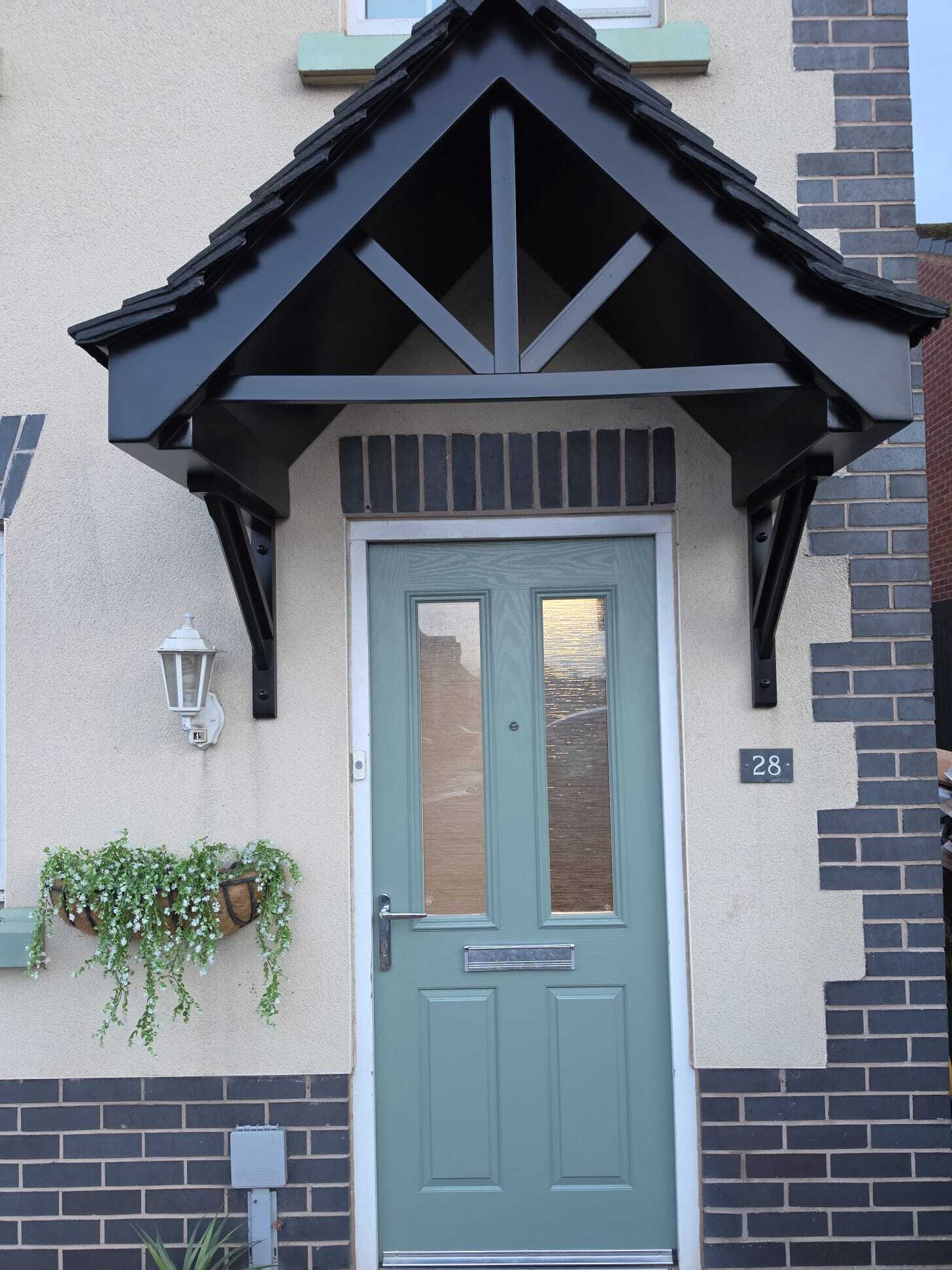 After: pastel green front door