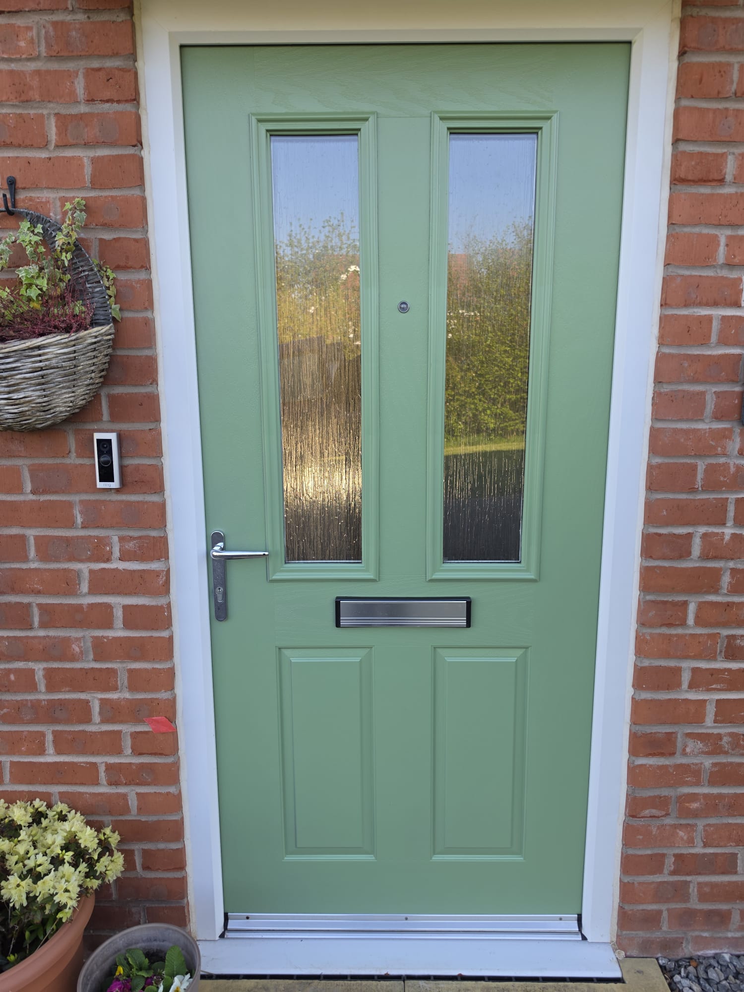 After: sage green composite front door