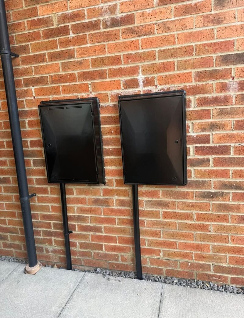 After: gloss black meter boxes and pipes