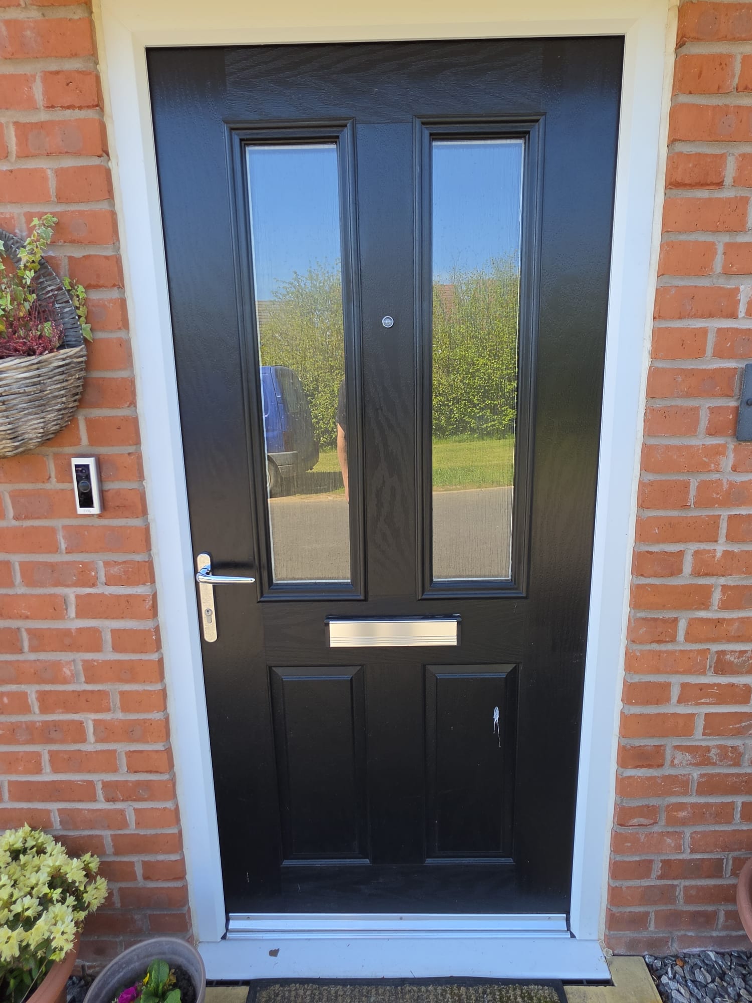 Before: black composite front door